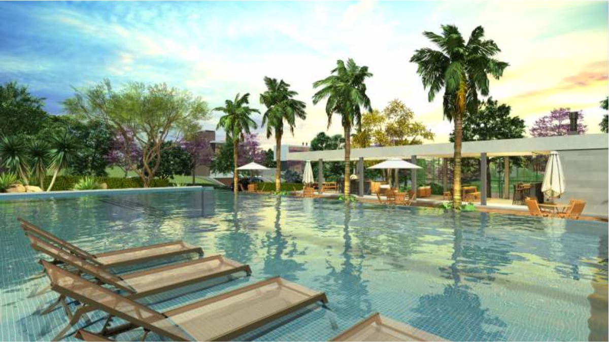 Piscina com borda infinita solarium e prainha